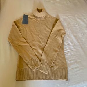 Woman’s turtle neck sweater Camel color